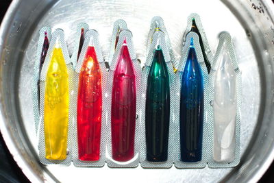 High angle view of multi colored glass on table