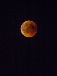 Low angle view of moon against sky at night