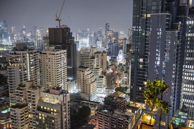 High angle view of illuminated buildings in city at night