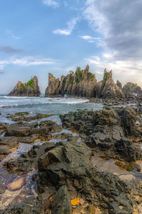 Panoramic view of waterfall against sky