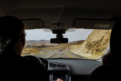 View of road through car windshield