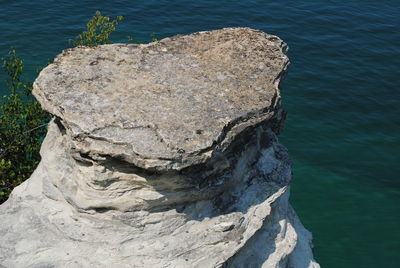 Close-up of rock at lake