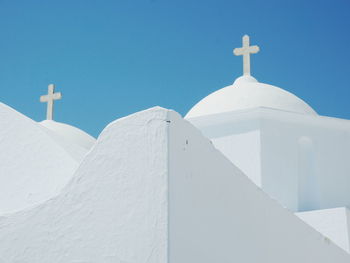 Low angle view of cross against clear sky