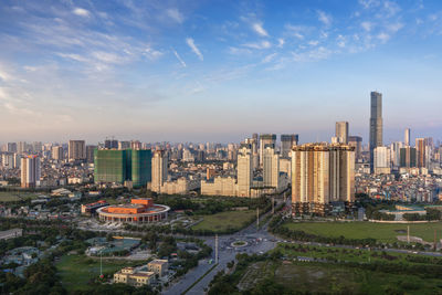 High angle view of modern buildings in city against sky