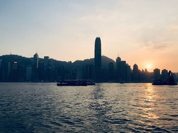 Scenic view of bay against sky during sunset