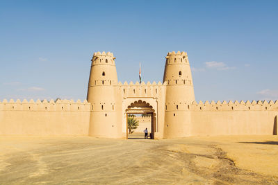 Low angle view of historical building against blue sky