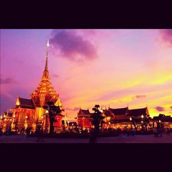 View of illuminated city at sunset