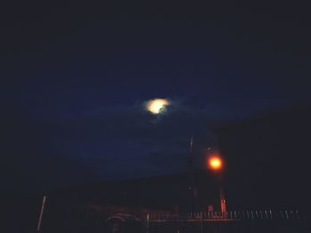 Illuminated lights against sky at night