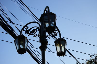 Low angle view of street light against sky