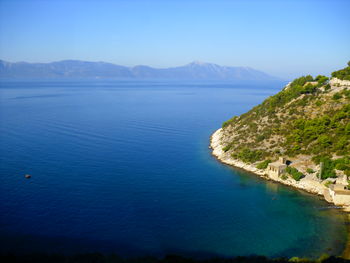 Scenic view of sea against clear blue sky