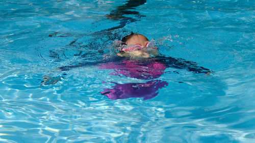 Girl swimming in pool