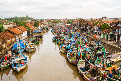 High angle view of canal amidst buildings in city