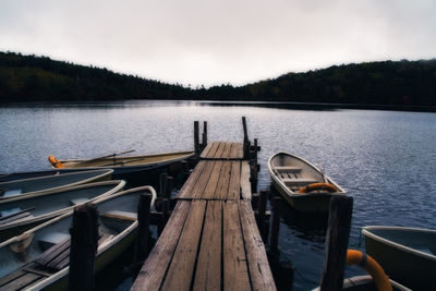 Pier over lake against sky