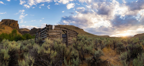 Panoramic view of abandoned mountains against sky