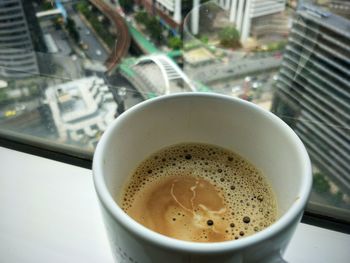 High angle view of coffee cup on table