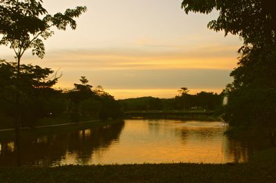 Scenic view of lake against sky during sunset