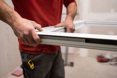 Midsection of man working