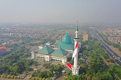 High angle view of buildings in city against sky