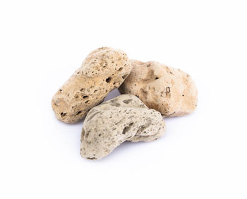 Close-up of rocks against white background