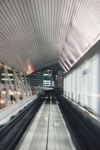 Illuminated railroad station platform at airport