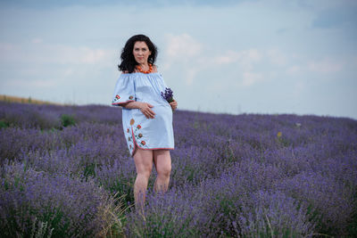 Full length of woman standing on field