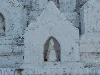 Small aedicula or shrine with naga sculpture placed inside, exterior around hsinbume pagoda.