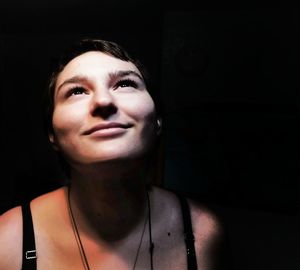 Portrait of a young woman looking away