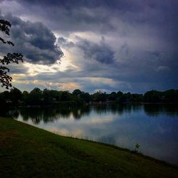 Scenic view of lake against cloudy sky