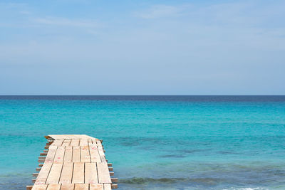 Scenic view of sea against blue sky