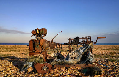 Rusting machinery on the beach