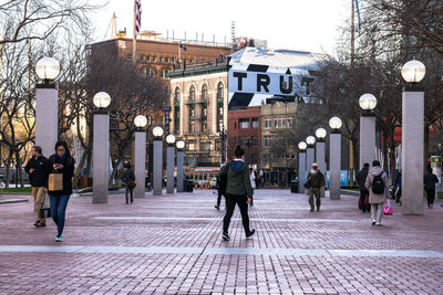 People walking on street in city