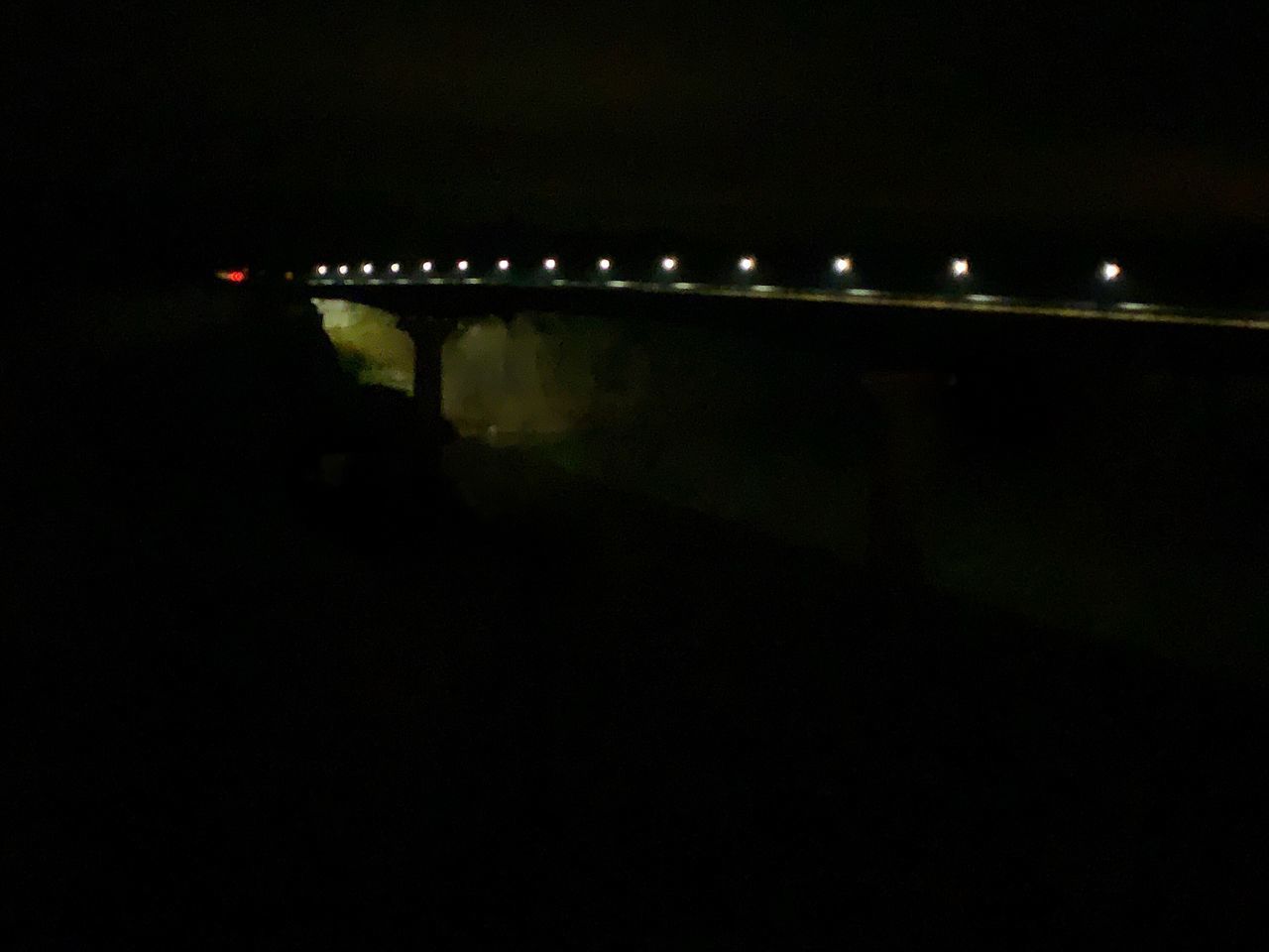 ILLUMINATED STREET LIGHTS AGAINST SKY AT NIGHT