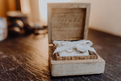 Close-up of wedding rings in box on table