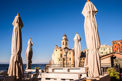 Panoramic view of buildings against blue sky