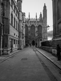 Road passing through city buildings