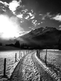 Scenic view of mountains against cloudy sky