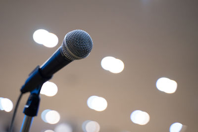 Low angle view of illuminated lighting equipment