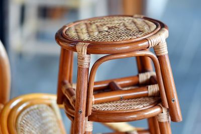 Close-up of wooden wicker stool for sale