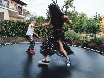 Full length of woman jumping outdoors