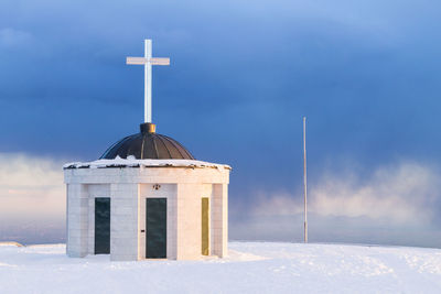 Building against sky during winter