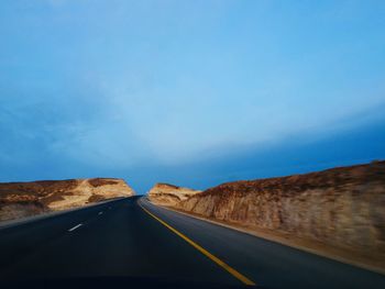 Road on landscape against sky