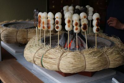 Close-up of hand holding wicker basket