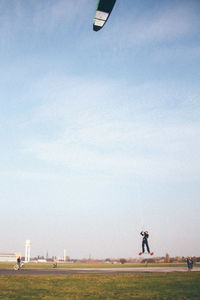 People on grass in field