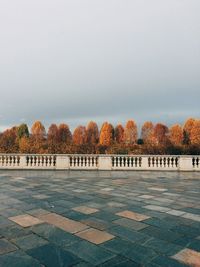 Scenic view of park against clear sky during autumn