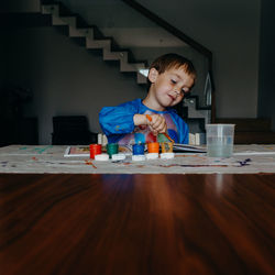 Boy playing on table