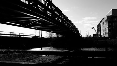 Bridge over city against sky