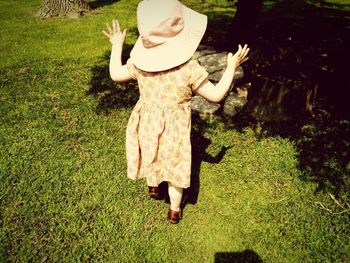 Full length of woman standing on grass