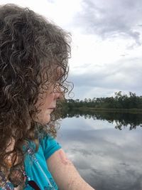 Side view of girl looking at lake