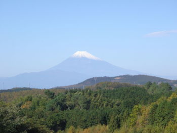 Scenic view of mountains against clear blue sky