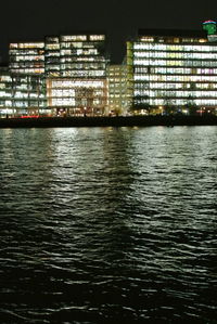 Illuminated buildings in city at night